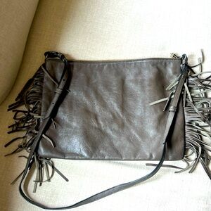 Leather bag with long shoulder strap.